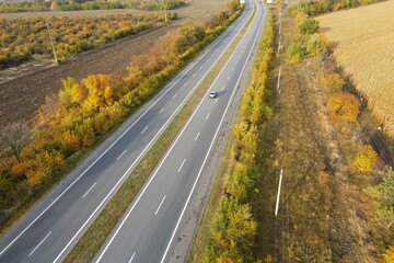 asphalt road. Road seen from the air. Aerial view landscape, dron photography. Autumn highway