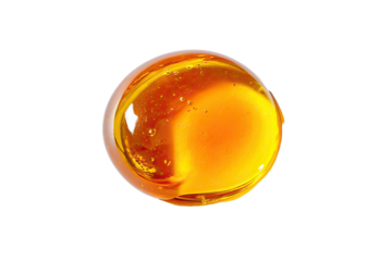 Amber, round, glossy drop of viscous liquid
