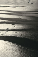 Footsteps on Wet Sand