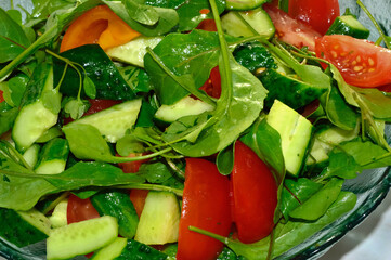 Close-up of a chopped cucumber, tomato and lettuce salad