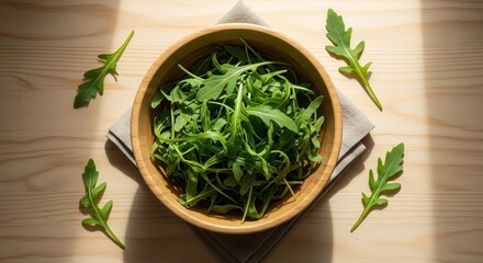 Fresh Arugula in a Wooden Bowl on a Light Wooden Surface with Natural Light