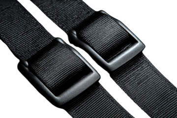 Close-up of two black straps with metal buckles
