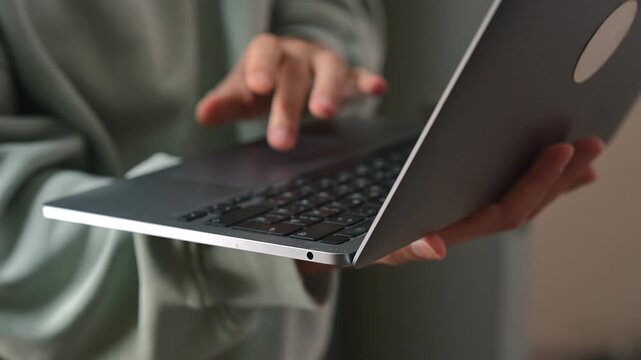 A man clicks on a laptop's touchpad with his finger.
Computer work and digital technology.
A man's finger on a computer keyboard.
Technology, device, laptop, touchpad, touchscreen, finger