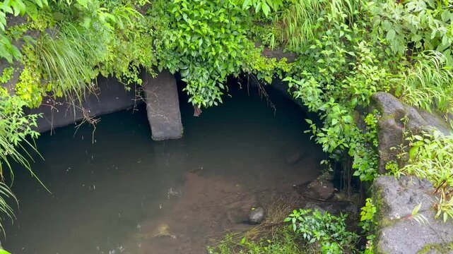 Rock cut water cistern for collection of natural mineral water during Maratha Empire at Mangad fort, Maharashtra