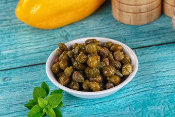 Pickled canned capers in the bowl