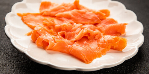 Smoked salmon fish seafood portion size natural product tasty snack fresh delicious gourmet food background on the table rustic top view copy space pescetarian diet