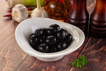 Mediterranean marinated Black olives in the bowl
