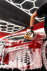 Hand car wash detailing sponge stage removes dirt and debris, leaving the car paint smooth and...