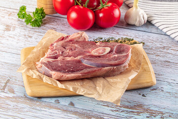 Raw lamb steak with bone