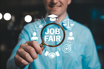 Man holding magnifying glass focusing on job fair concept with icons representing career opportunities recruitment education and professional growth ideal for employment and hiring campaigns