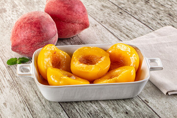 Sweet ripe yellow canned peaches
