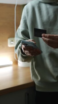 A person enters bank card information to transfer money and pay for purchases.
Financial transactions.
Monetary transactions and budget allocation.
Economics, finance, utilities, shopping