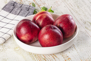 Ripe sweet juicy nectarines heap