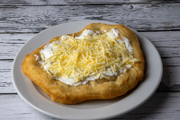 Hungarian classic street food - deep fried flatbread, lángos