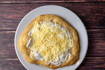 Hungarian classic street food - deep fried flatbread, lángos