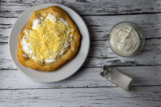Hungarian classic street food - deep fried flatbread, l&aacute;ngos