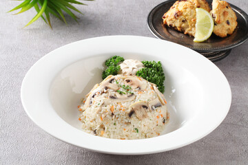 A Korean-style fried rice made with fresh mushrooms and vegetables sautéed in soy sauce for a savory and balanced flavor. Created by Master Chef Hanshunseop. Photographed in Korea.
