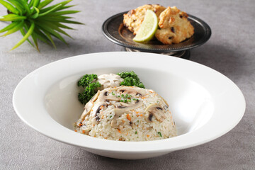 A Korean-style fried rice made with fresh mushrooms and vegetables sautéed in soy sauce for a savory and balanced flavor. Created by Master Chef Hanshunseop. Photographed in Korea.