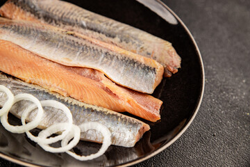 Herring fillet fish fresh seafood portion size natural product tasty snack fresh delicious gourmet food background on the table rustic top view copy space pescetarian diet