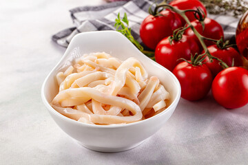 Canned marinated squid rings heap