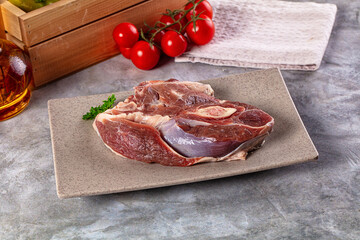 Raw lamb steak with bone