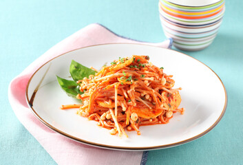 A Korean-style side dish made with fresh enoki mushrooms lightly seasoned with sesame oil, soy sauce, and garlic for a savory and fresh taste. Created by Master Chef Hanshunseop. Photographed in Korea
