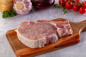 Raw pork steak with bone