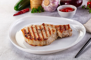 Tasty hot grilled bone steak served sauce