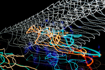 Abstract background, colored lines on black background	