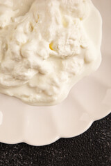 Stracciatella cheese soft young portion size Italian food natural product tasty snack fresh delicious gourmet food background on the table rustic top view copy space