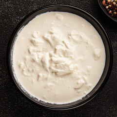 Stracciatella cheese soft young portion size Italian food natural product tasty snack fresh delicious gourmet food background on the table rustic top view copy space