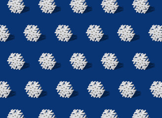 Repeat Winter Snowflake Pattern on a Navy Blue Background