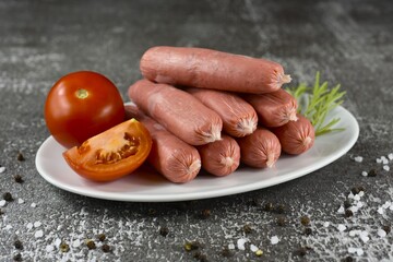 Eight pork and tomato sausages.