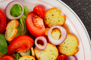 Panzanella salad tomato, croutons, onions vegetables dish natural product tasty snack fresh delicious gourmet food background on the table rustic top view copy space