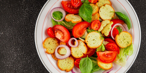 Panzanella salad tomato, croutons, onions vegetables dish natural product tasty snack fresh delicious gourmet food background on the table rustic top view copy space