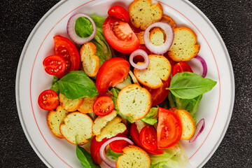 Panzanella salad tomato, croutons, onions vegetables dish natural product tasty snack fresh delicious gourmet food background on the table rustic top view copy space
