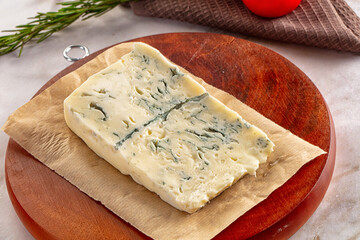Tasty Italian gorgonzola cheese over board