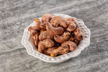 Unpeeled cashew nuts in the bowl