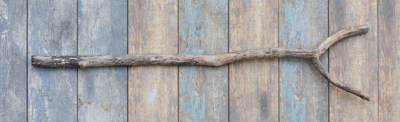 ancient wooden staff on a wooden background