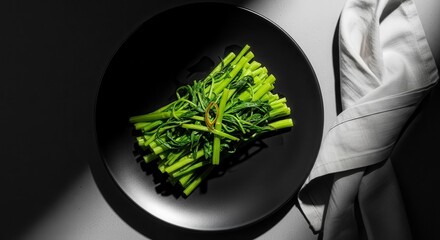 Fresh Verdant Greens, Artfully Arranged On A Dark Plate With Subtle Shadows