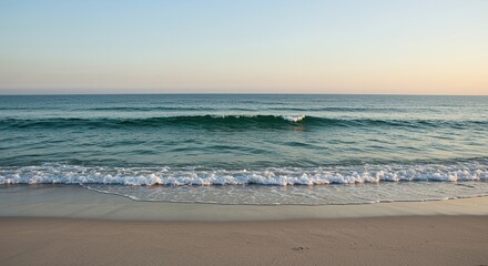 Gentle ocean waves caress a wide, pristine sandy shoreline under a vast, clear sky, creating a tranquil and expansive natural vista ,scenic ,pristine ,expansive