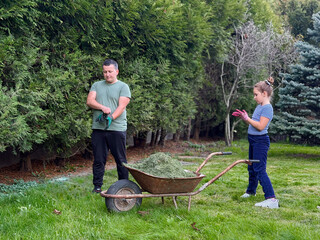 Family gardening together in the backyard