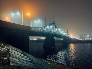 A bridge over a river with lights on it