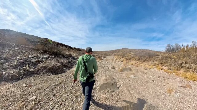 Man Hikes Down Gravel Wash in Big Bend National Park