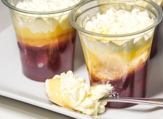 a delicious strawberry trifle in a plastic jar