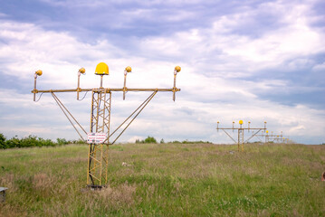 Approach lights, which are part of the runway lighting system at an airport. Help pilots visually identify the runway and land safely