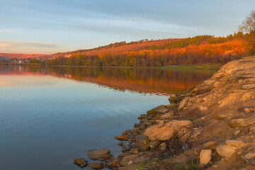 Peaceful autumn landscape in the Republic of Moldova with colorful forests, golden trees, and gentle sunlight