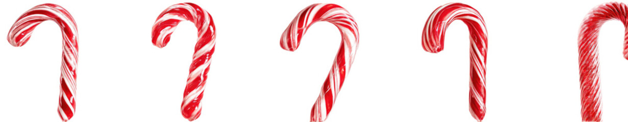Fototapeta premium Four candy canes in red and white stripes against a black background