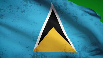The national flag of Saint Lucia a vibrant symbol of the Caribbean island nation gently waves in the breeze showcasing its distinctive blue gold black and white triangular design.