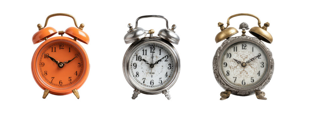 Three vintage-style alarm clocks in orange, silver, and gray